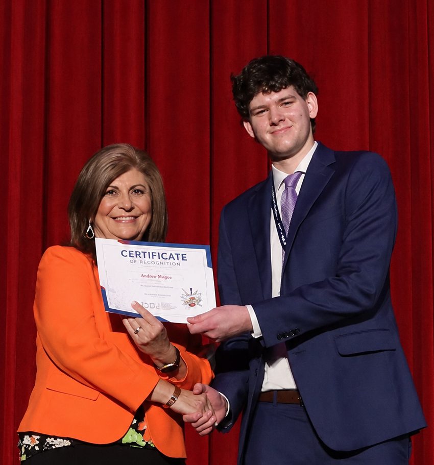 A student receiving an award on stage